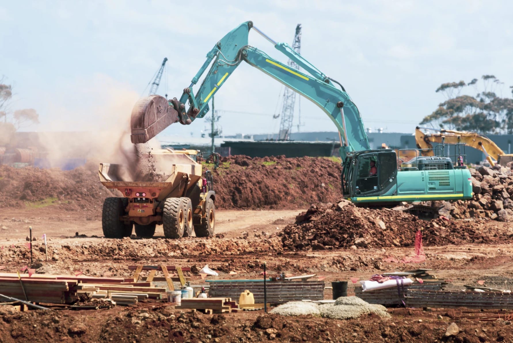 Blue Excavator And Truck — Excavators In Mackay, QLD